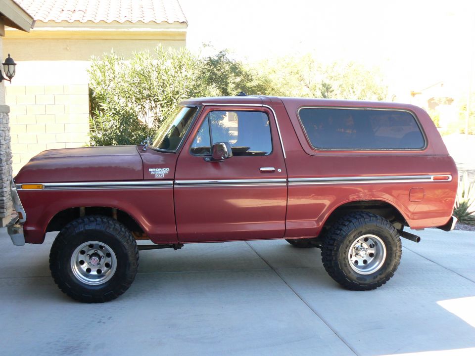 1978 Ford Bronco parked on a driveway, side view