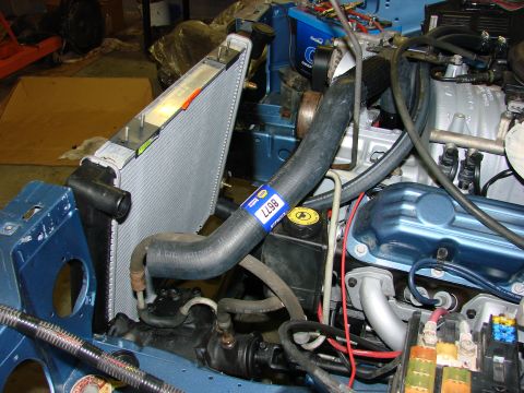 1991 Jeep Comanche - Close-up view of a vehicle's engine bay, highlighting the radiator and associated hoses and components.