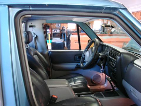 1991 Jeep Comanche - Interior view of a 1991 Jeep Comanche, highlighting the seats and dashboard.