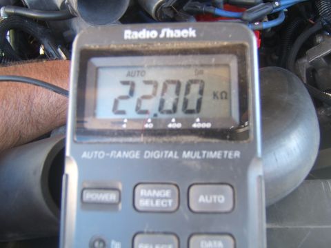 1988 Ford Bronco - A Radio Shack auto-range digital multimeter displays a resistance reading of 22.00 k ohms.