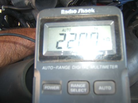 1988 Ford Bronco - A Radio Shack digital multimeter is shown, displaying a reading of 2200 ohms.