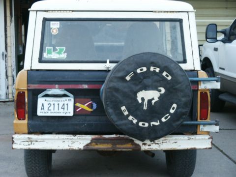 1966 Ford Bronco - Rear view of a 1966 Ford Bronco, showing the spare tire cover and license plate.