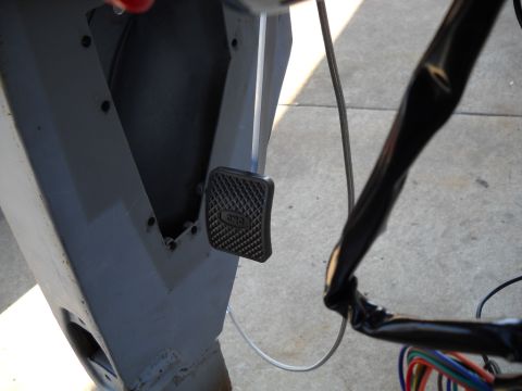 1954 Ford F-100 - A close-up view shows a brake pedal and a section of a wiring harness.