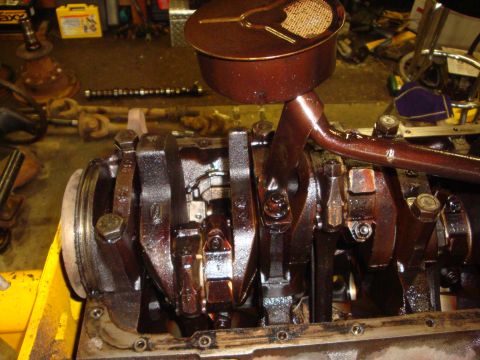 1989 Ford Bronco - Close-up of an engine's internal components, including the crankshaft and connecting rods.