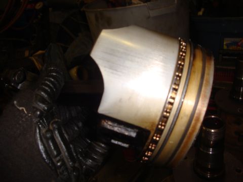 1989 Ford Bronco - A close-up view of a piston and connecting rod assembly, likely undergoing engine maintenance.