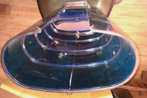 1991 Ford Crown Victoria - This is a close-up view of a clear plastic lens, likely from a police light bar, showing its ribbed interior.