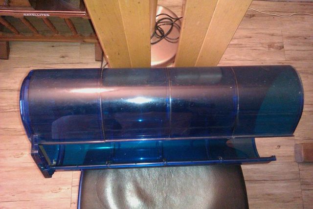 Blue plastic police light bar with metal mounting brackets