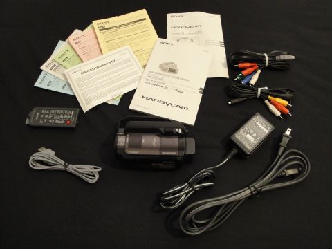 1993 Ford Taurus - Sony Handycam camcorder, remote, manuals, cables, and power adapter are displayed on a black background.