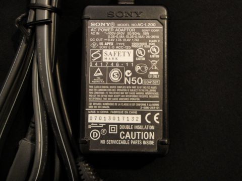1993 Ford Taurus - Sony AC Power Adapter, model AC-L200, with cables and safety certifications visible.