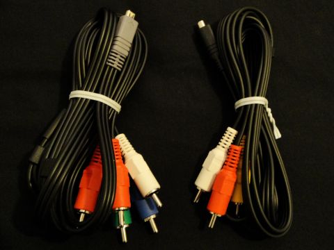 1993 Ford Taurus - Two sets of AV cables are shown, one with RCA connectors and another with a gray connector, against a dark background.