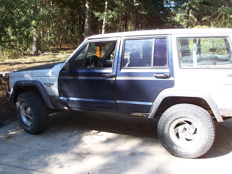 1992 Jeep Cherokee side profile, showing two-tone paint and aftermarket wheels