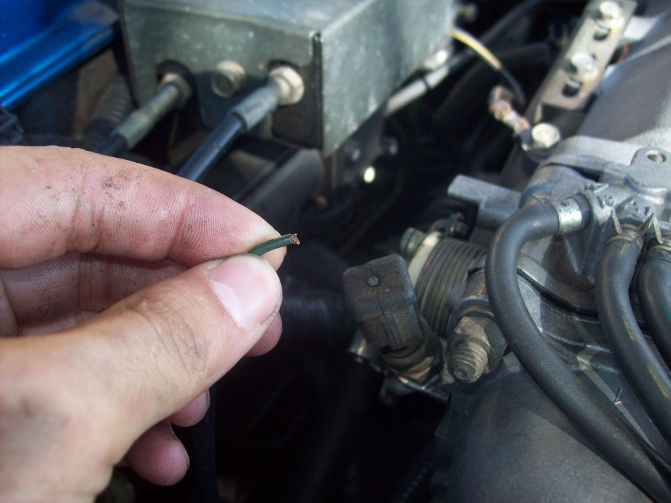 Broken green wire in engine bay near throttle body