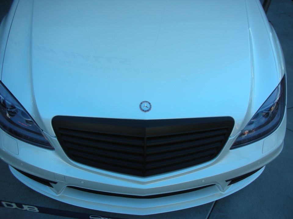 White Mercedes-Benz front end with black grille and headlights