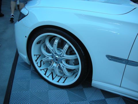 1998 Ford Crown Victoria - The custom wheel features the brand name 'ASANTI' in large black lettering on the white rim.
