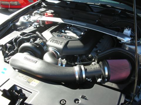 1998 Ford Crown Victoria - Open Mustang engine bay showing a 32V Ti-VCT coil cover, Roush plumbing and a Vortech supercharger with cone filter.