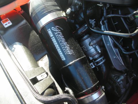 1998 Ford Crown Victoria - black intake pipe marked Granatelli Motorsports Twin Turbocharged runs through a detailed engine bay.