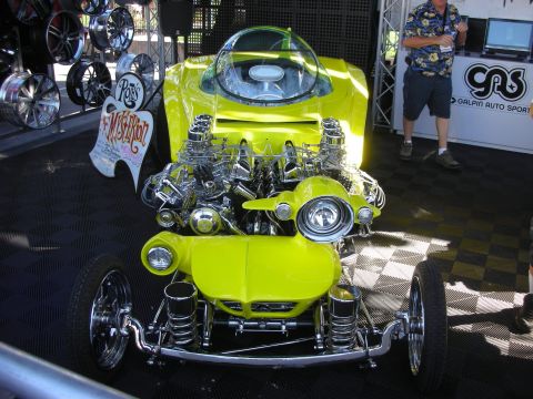 1998 Ford Crown Victoria - wild yellow custom show car with a clear bubble canopy and twin exposed chrome engines.