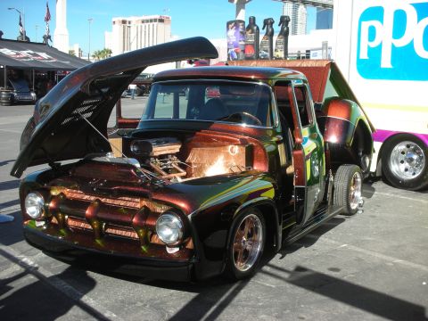 1998 Ford Crown Victoria - custom mid-1950s pickup with candy metallic paint, open hood showing chrome engine and upward doors.