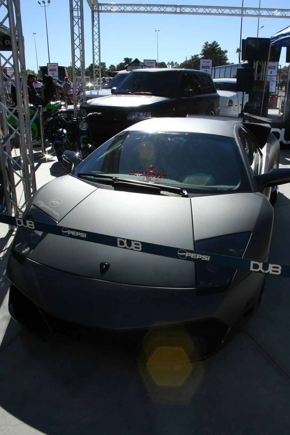 Matte gray Lamborghini Murciélago with DUB and Pepsi branding tape across the hood