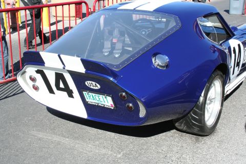 1998 Ford Crown Victoria - Rear view of a blue race coupe with white stripes and number 14, styled like a Shelby Daytona, on white wheels.