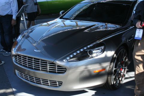 1998 Ford Crown Victoria - Close front view of a gray Aston Martin Rapide showing its wide mesh grille and LED-trimmed headlights.