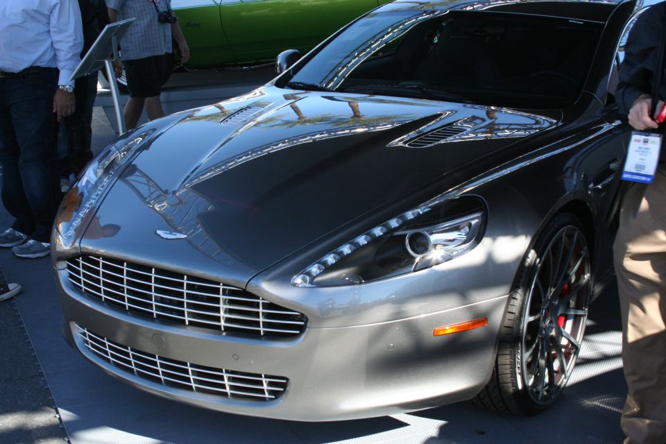 Front of gray Aston Martin Rapide sedan with mesh grille and LED headlights