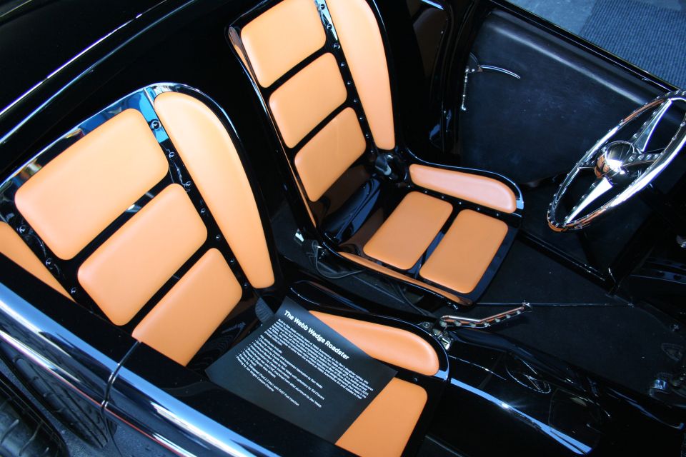 Interior of hot rod with tan and black tuck-and-roll upholstered seats