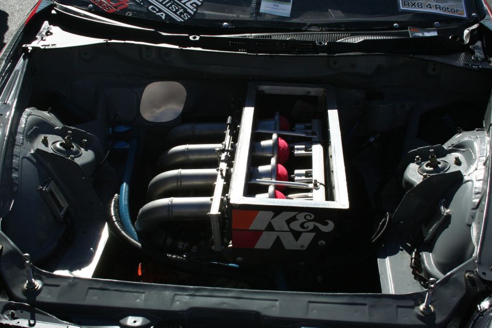 Engine bay with individual throttle bodies and red K&N filters