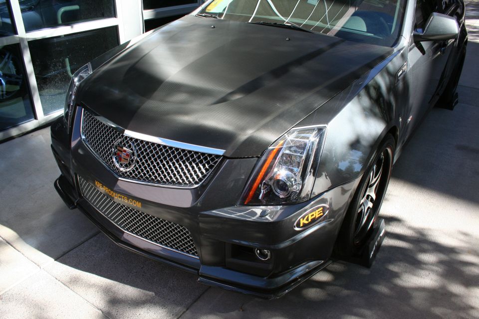 Front of gray Cadillac CTS-V coupe with mesh grille and KPE splitter