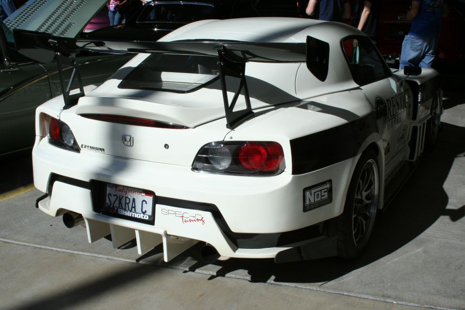 Rear of white Honda S2000 race car with large wing and SZKRA plate