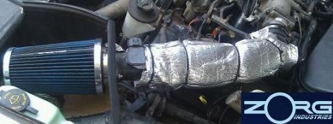2000 Mercury Grand Marquis - Aftermarket air intake system installed in the engine bay, a blue filter and insulated tubing.