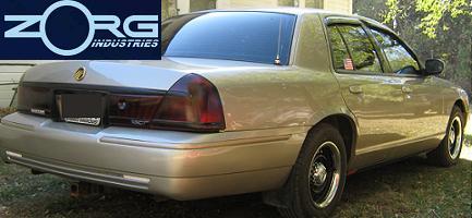 2000 Mercury Grand Marquis - Rear view of a tan 2000 Mercury Grand Marquis sedan.