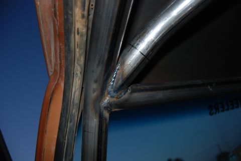 1982 Ford Bronco - Custom roll cage fabrication is underway, showing welded metal tubes and structural reinforcements.