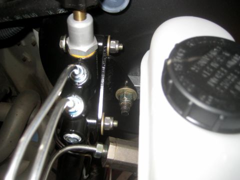1996 Ford Bronco - Close-up of a vehicle's brake master cylinder and fluid reservoir assembly.