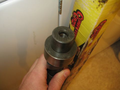 1981 Ford Bronco - Camshaft held in hand, with a 'COMPETITION CAMS' box visible in the background.
