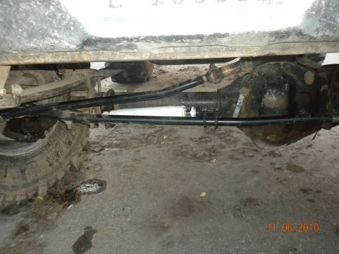 1989 Ford Bronco - Undercarriage view showing the rear axle assembly and suspension components.