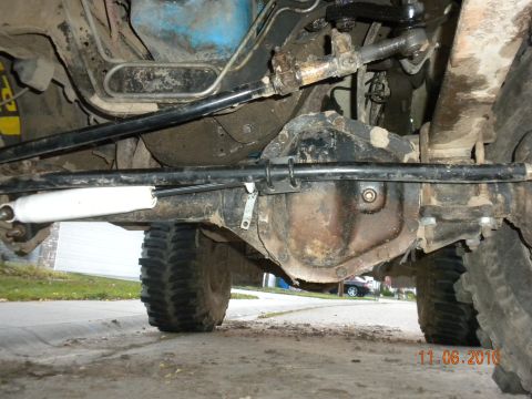 1989 Ford Bronco - Close-up of vehicle undercarriage, focusing on steering and suspension components.