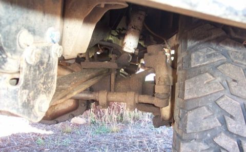1990 Ford Bronco - Here's a poser shot in my front yard. Here the driver's front is stuffed. Quite a bit of negative arch on that sping