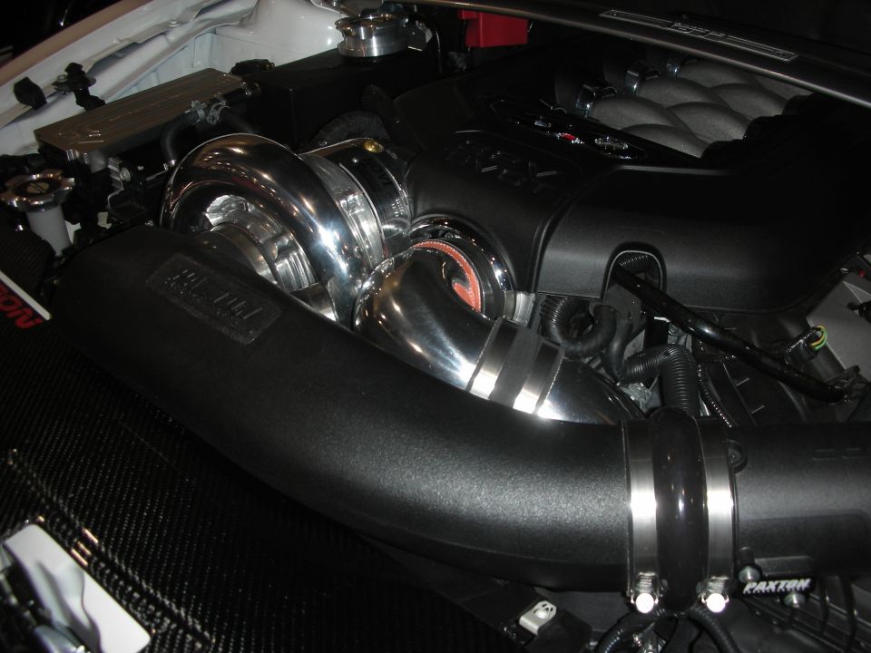 Twin-turbo or supercharged engine bay with Paxton intake and chrome piping