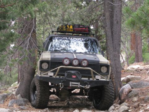 1986 Ford Bronco - This modified van is equipped for off-road adventures with a winch and cargo on the roof rack.