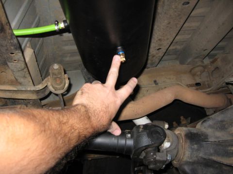 1995 Ford Bronco - Vehicle underbody with installed air tank and driveshaft components visible.