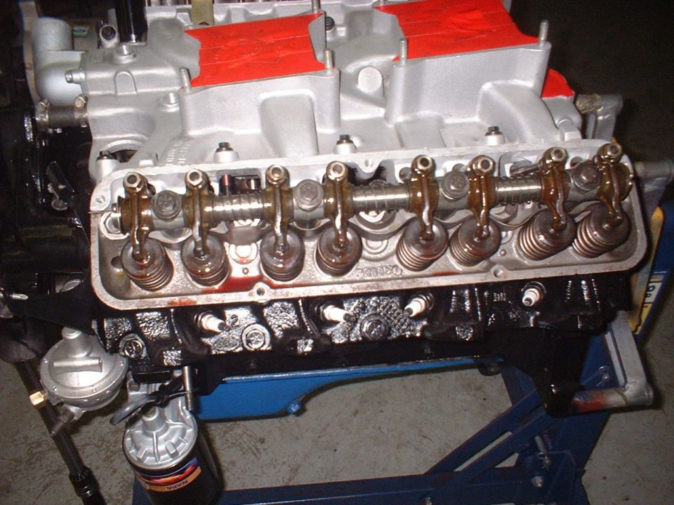 Close-up of an engine with silver intake manifold and black block