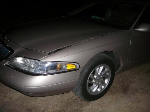 1997 Lincoln Mark VIII - Front corner view of a 1997 Lincoln Mark VIII, showing the headlight and wheel.