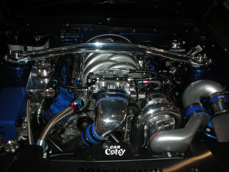 Highly detailed engine bay with polished supercharger and Car Crazy plaque