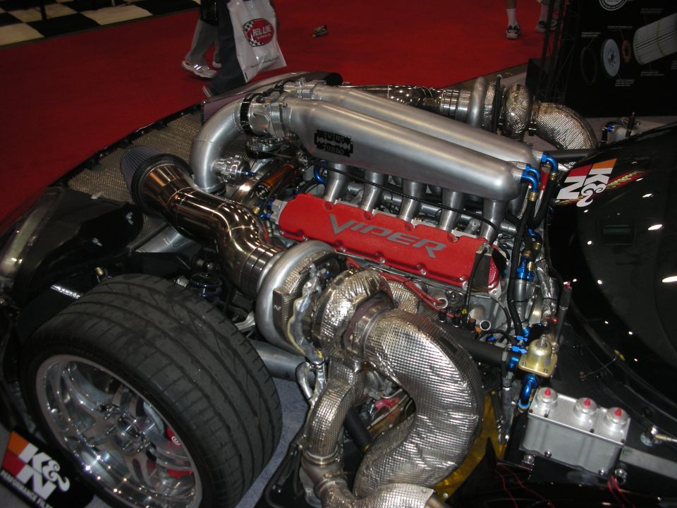 Twin-turbo V10 engine with Viper red valve covers in a show car bay