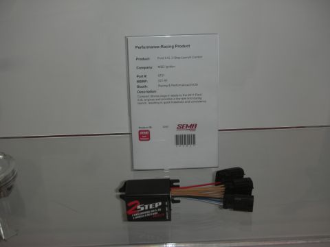 1998 Ford Crown Victoria - compact 2-Step launch control module with a multicolor wiring harness sits on a shelf beneath a printed SEMA product card.