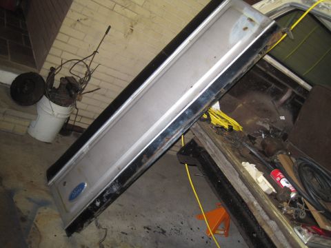 1979 Ford Bronco - Tailgate from a Ford vehicle, likely a Bronco or F-Series truck, in storage.