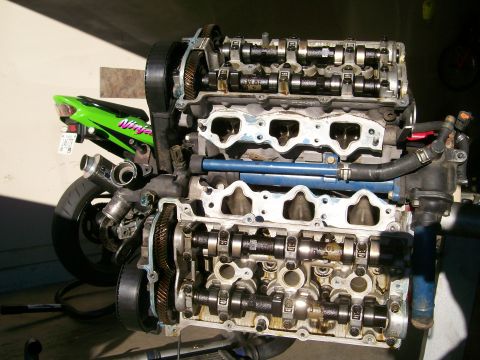 1995 Ford Probe - Engine block and motorcycle tail section are visible in this image.