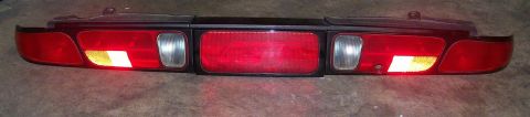 1995 Ford Probe - A car taillight assembly is shown, detached from a vehicle.