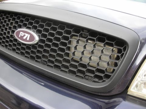 2004 Ford Crown Victoria - Front grille detail on a 2004 Ford Crown Victoria P71, showing the P71 emblem.